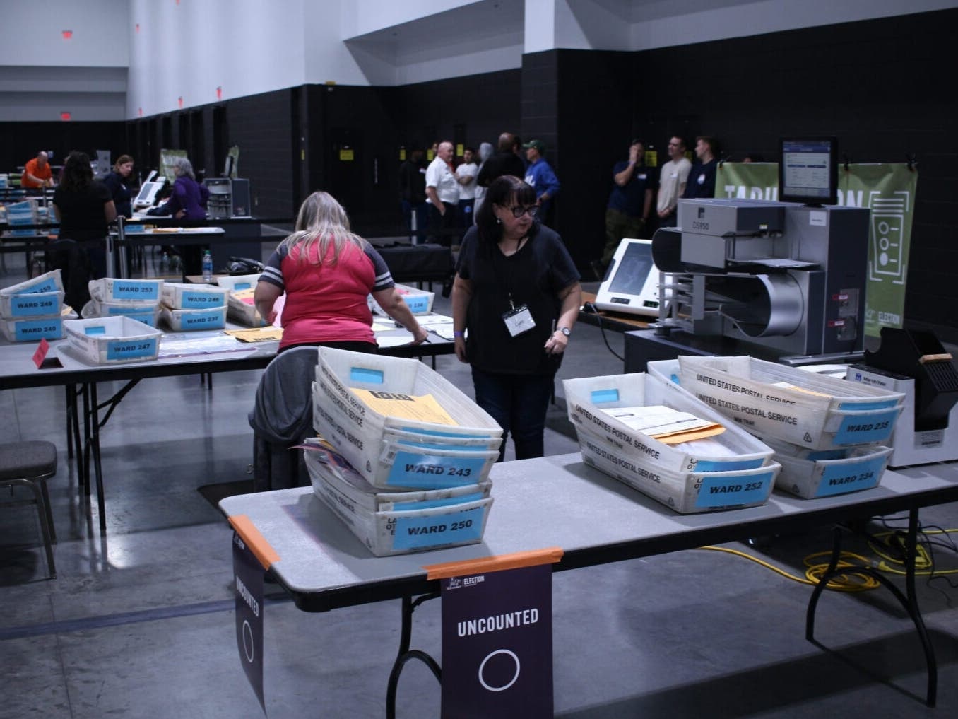 Boxes of ballots wait to be counted at Milwaukee’s central count on Election Day 2024. 