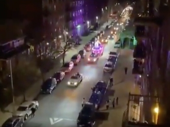 A newlywed couple invited their Crown Heights neighbors to celebrate with them from a safe distance after the coronavirus forced them to change their wedding plans.