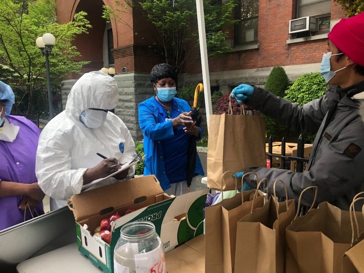 Volunteers passed out 250 bags of fresh fruit to hardworking staff at Cobble Hill Health Center, where 50 patients died during outbreak.