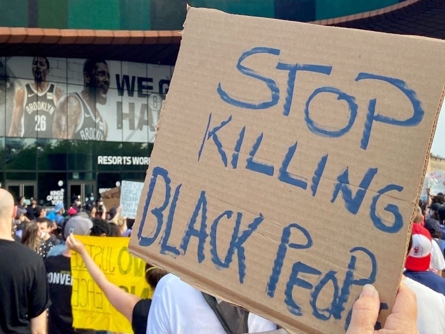 Brooklyn elected officials called for the firing of a NYPD officer caught on viral video violently shoving a woman.