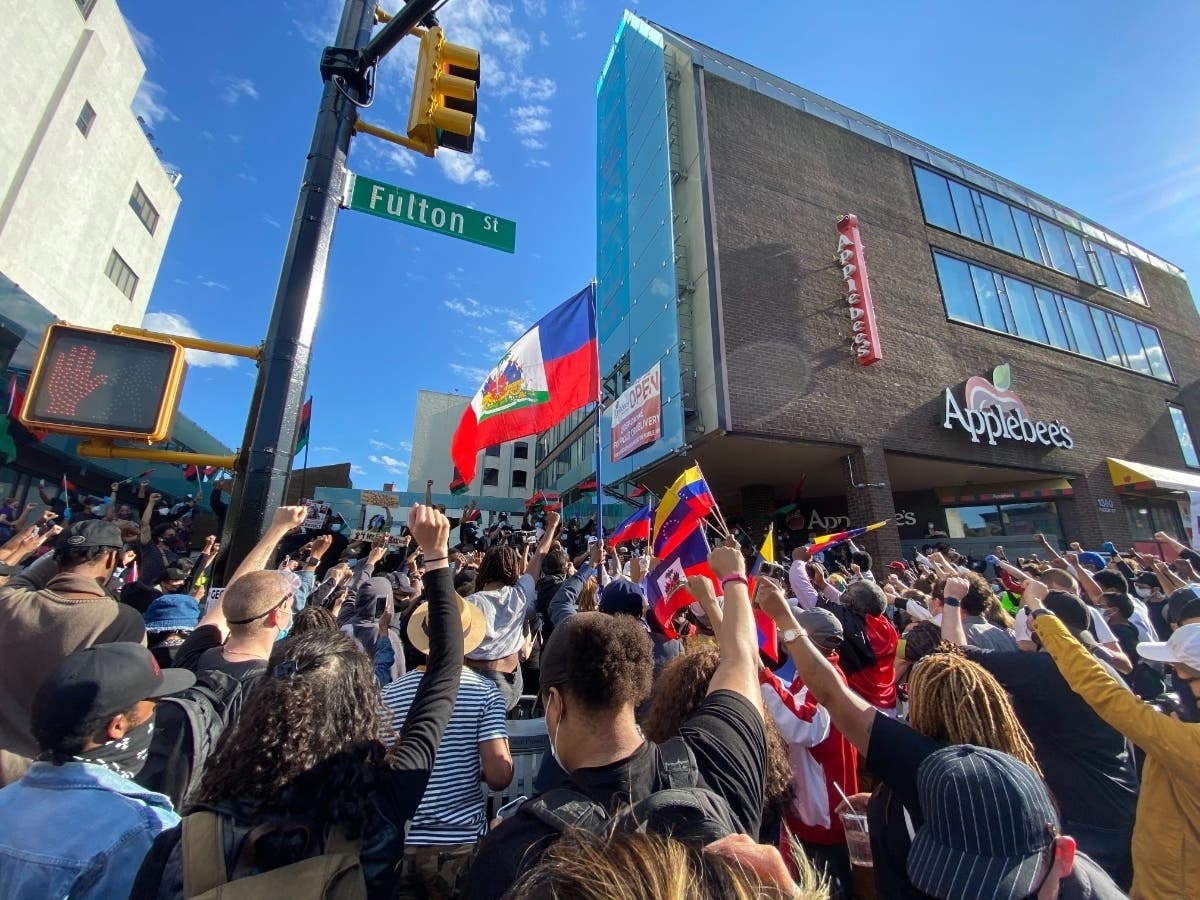 Protesters gathered on Fulton Street in Bed-Stuy on Monday in a peaceful rally over the killing of George Floyd and police brutality.