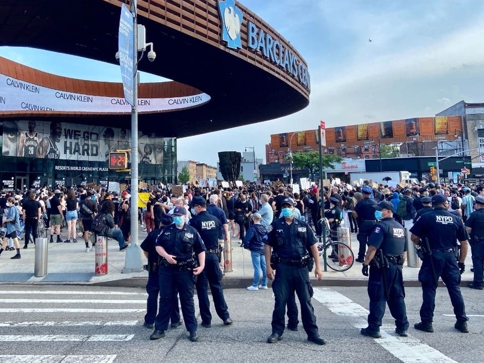 NYPD officers gather outside Barclays Center during a May 29 protest over the killing of George Floyd.