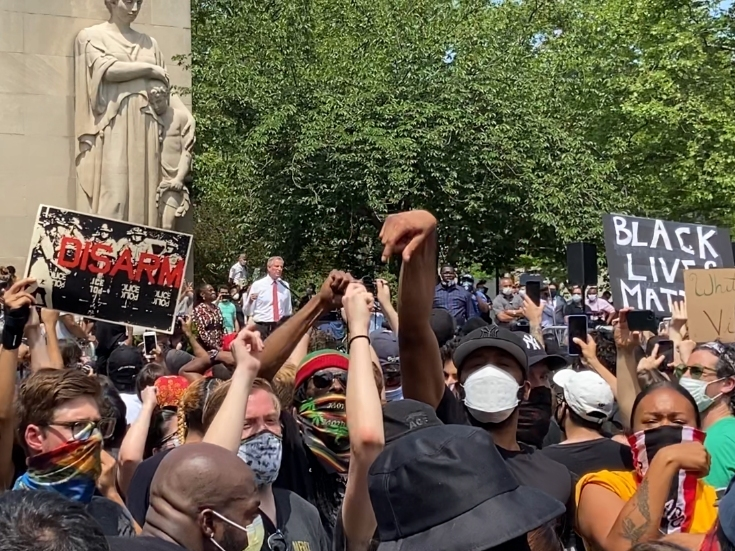 A crowd turned its back on Mayor Bill de Blasio during a memorial for George Floyd on Thursday.