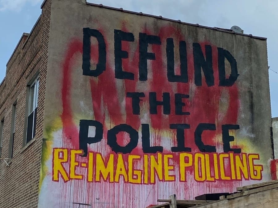 A Brooklyn mural spells out the demands of protesters whose marches on New York City prompted city officials to focus on the NYPD.
