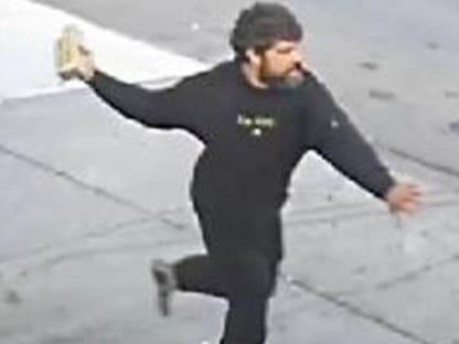 The suspect behind a violent Lower East Side confrontation is still on the loose, NYPD said.