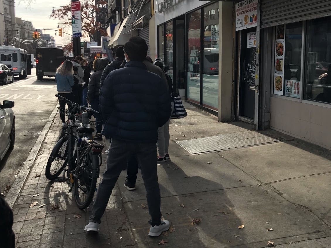 A line of people wait for COVID-19 tests on Thursday.