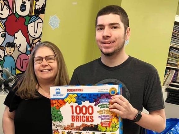 Parker Krex, 15, of Deerfield and CEO of BRICK Loot, delivered holiday gifts to children living at Chicago’s Lydia Home Association, Dec. 23, 2019.  Krex donated the gifts to help build a brighter holiday season for local foster and homeless youth. 