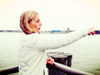Leslie Boghosian Murphy stands on the Pier adjacent to Manhattan Cruise Ship Terminal where cruise ships emit toxic fumes while they are docked. She is a champion for shore power which would clean up the air in Midtown West. 