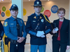 Members of the Voorhees Police Department with Stella Sytnik of Voorhees Township at the Fallen Comrade Ceremony at Voorhees Town Center. 