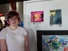 Student artist Stephanie Lombardo of Gloucester County Institute of Technology stands with her artwork at the 2024 Tri-State DisAbility Art Show. 