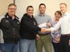 Ralph LoPriore presents a check to the Round Lake Area Park District to help families with financial challenges send their children to summer camp.