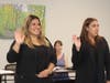 New Round Lake Area Park District Board Commissioners Massiel Sanchez Giles and Nathalie Alvarez are sworn in at the July meeting, while Commissioner Sarah Wright, who was elected in the spring, looks on.