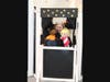 Dena Krieger, Recreation Supervisor for the Children's Neighborhood Museum, uses the Puppet Theater created by Boy Scout Sean Buchenberger.