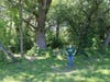 Kathy Paczynski, Recreation Supervisor of the Prairie Grass Nature Museum and Huebner Fishery Management Foundation, stands in Fairfield Park. This grant will support removal of invasive woody species and hazardous trees in the park.