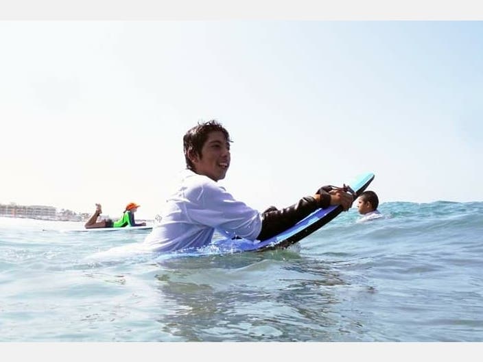Pedro Sanchez Jr. learns how to catch a wave through Outdoor Outreach, an organization that connects inner-city San Diegan youth with nature.