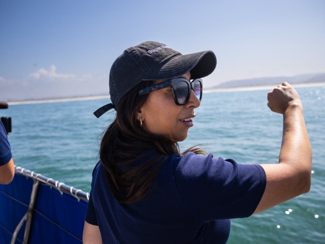 San Diego County Supervisor Paloma Aguirre points out the Tijuana River mouth from the Pacific Ocean, Thursday, Sept. 4, 2025