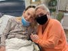 Mother and daughters reunited-- Sarah Tarr (resident) and Susan Mulligan (daughter) embrace after months apart. 