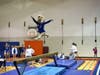 Sommer Schmidt shows her style on beam.