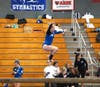 Co-captain Kerry McDermott achieves a spectacular jump on beam.