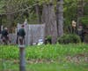 Law enforcement using drones, K9s, and multiple officers searched heavily wooded areas around Mallard Dr and Joey Rd in Merrimack.