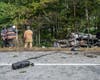 The crash involves two commercial vehicles and one passenger vehicle. One vehicle caught fire, and there is an active oil leak