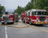 The crash involves two commercial vehicles and one passenger vehicle. One vehicle caught fire, and there is an active oil leak