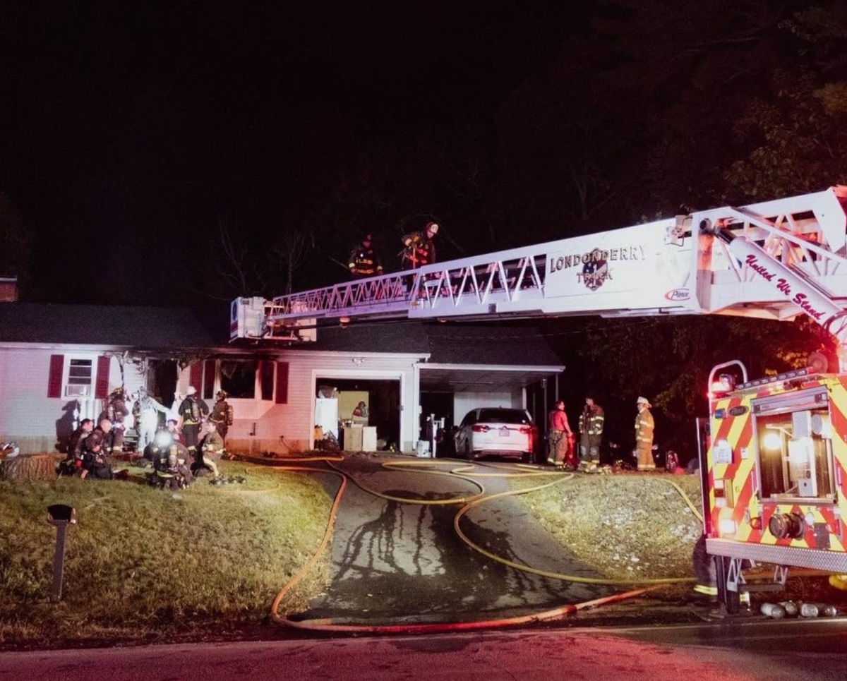 Londonderry firefighter injured at a 2-alarm fire while searching for occupants and pets on Rockingham Road.