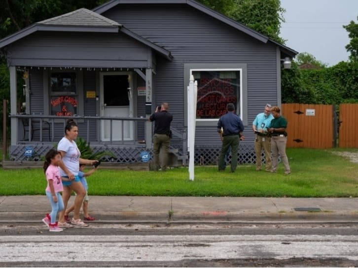 Investigators work near the Houston location of a fatal ICE shooting July 7. Statistics released July 20 show a record number of immigration arrests in June and an even higher rate in early July. 