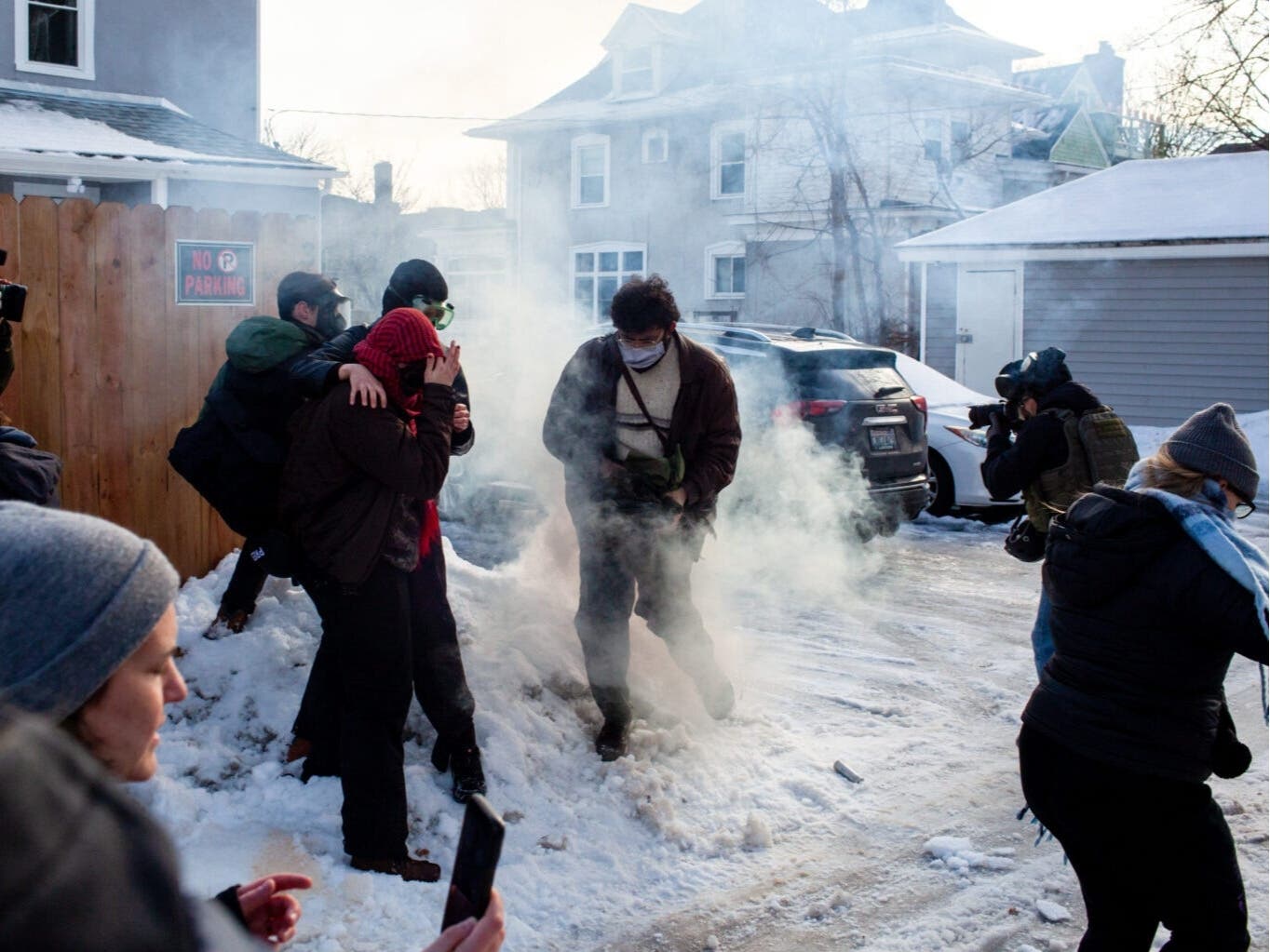 Federal agents fill an alley with tear gas in order to drive out of the alley as demonstrators gather after ICE officers shot and killed Renee Good through her car window Wednesday, Jan. 7, 2026 near Portland Avenue and 34th Street.