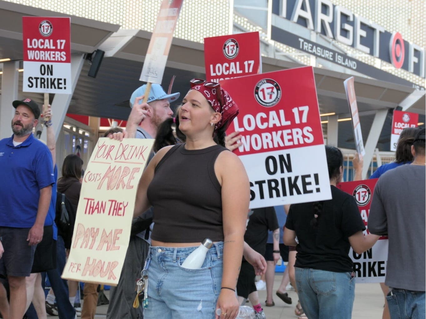 Dozens of concessions workers picket outside Target Field during a one-day strike on June 22, 2026.