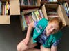 Girl Scout Niamh O'Donovan organizes books