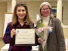 Dr. Samantha Gross accepts the Advancing the Status of Women Award for Bucks County Community College from Jenny Lichtner, SIIR president.