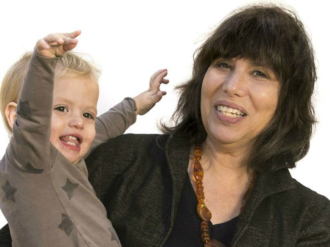 UC Berkeley psychologist Alison Gopnik, holding her grandson Atticus, is winner of the 2021 James McKeen Cattel Fellow Award.
