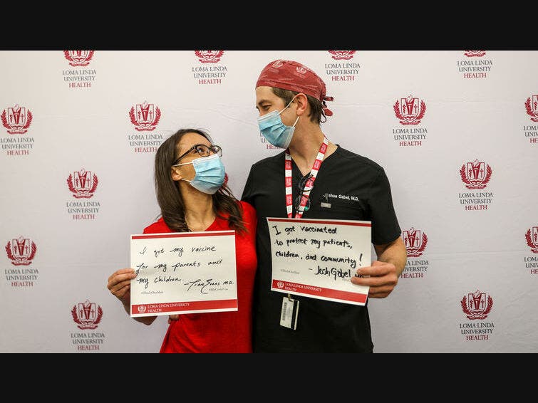 Tiera Evans, MD, was joined by her husband, Joshua Gabel, MD, to get vaccinated.