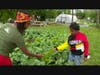 Farmer Tiara and a young volunteer at Plantation Park Heights urban farm