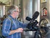 MPT producer Jay McDonald sets up a video shot at Distillery Lane Ciderworks in Frederick County.