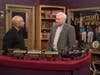 Appraiser Michael Stanton (camera right) during a previous episode of Chesapeake Collectibles evaluates a mint-condition toy train manufactured by German company Märklin in the early 1900s. (Collector's name unavailable.)
