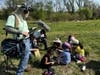 Young volunteers participate in an Earth Day tree planting initiative at The REED Center for Ecosystem Reintegration in Middletown.