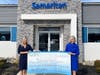 Samaritan’s 2022 Gala Chair Jamie Bratton of Innovative Benefit Planning (left) and Samaritan President/CEO Mary Ann Boccolini (right) stand with a $151,000 donation from the organization’s 2022 Celebration of Life: Above and Beyond Gala.