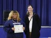 Marisol from Collingswood High School accepts an award from Lora Marie Durr, President, Art Educators of New Jersey. 