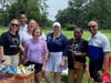 Samaritan President & CEO Phillip W. Heath (far right) with Women at Amazon volunteers, who generously donated their time and efforts to assist with Samaritan’s 2023 Drive FORE! A Good Cause golf tournament. 