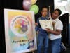 Student artist Remi Kenly of Archbishop Damiano School, pictured with his mom, proudly accepted an award for his artwork at the 2024 Tri-State DisAbility Art Show. 