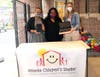 Accepting digital learning devices (left to right): Aseelah Williams, Development Coordinator, ACS; Candace Bazemore, Digital Marketing Manager, LogistiCare;  Allison Griffith, Donor Relations Manager, ACS.