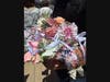 Floral gifts and bouquets are offered to graduates after the graduation.A lady joked, the graduate might want to see  $100 instead of $1.