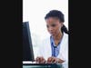 Portrait of a female doctor using a computer