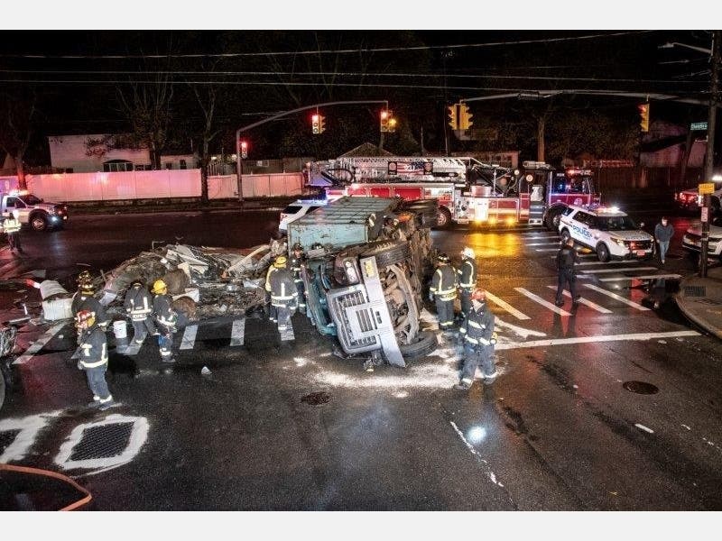 A scrap metal truck overturned in an early-morning crash on Monday. 