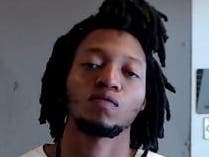 Faruk Adedapo Fadesire was taken into custody Wednesday in connection with the fatal shooting of a Stone Mountain woman last month.