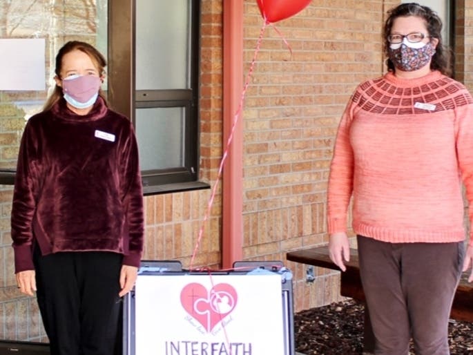 San Ramon Valley United Methodist Senior Pastor Kim Risedorph (left) and HollyAnn Melton demonstrate social distancing which was observed throughout a recent interfaith  blood drive in Danville.