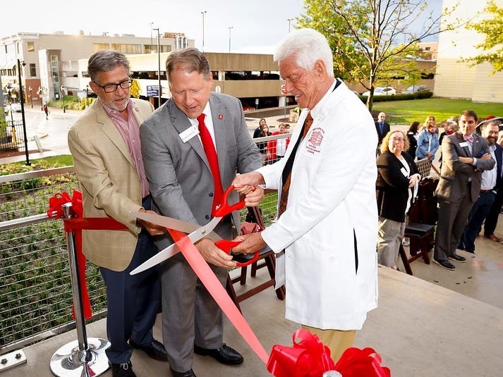  Former Vice President for Institutional Advancement Rick Spencer (left), North Central President Troy D. Hammond (center), and Dr. Myron Wentz, (right) cut the ribbon on the new Dr. Myron Wentz Center for Health and Engineering last week. 