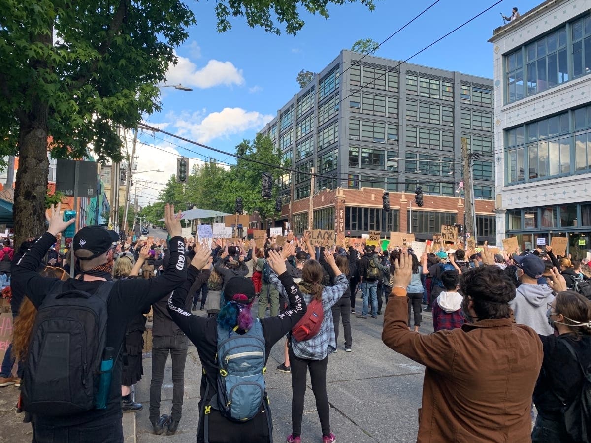 Protesters chanting "hands up, don't shoot" at a rally in Seattle's Capitol Hill neighborhood Sunday. 